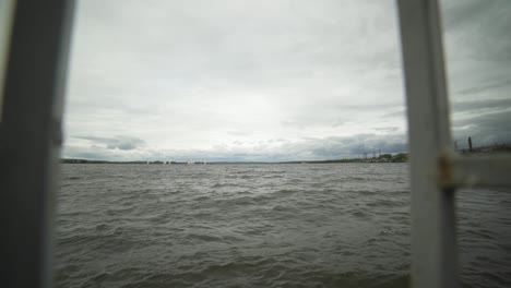 river view through fence on a cloudy day