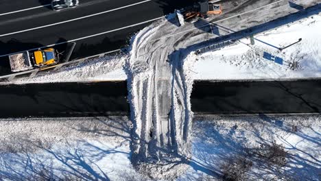 an aerial view of a highway after a heavy snowfall