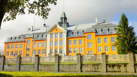 Main-Facade-And-Fence-Of-Kongsbakken-Upper-Secondary-School-On-A-Sunny-Day-In-Autumn-In-Tromso,-Norway