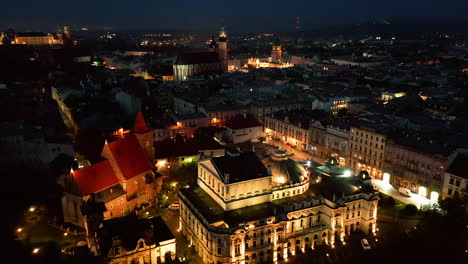 panorama of illuminated old town in krakow, poland at night