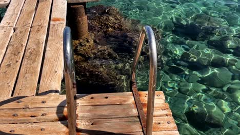 crystal clear water and wooden dock