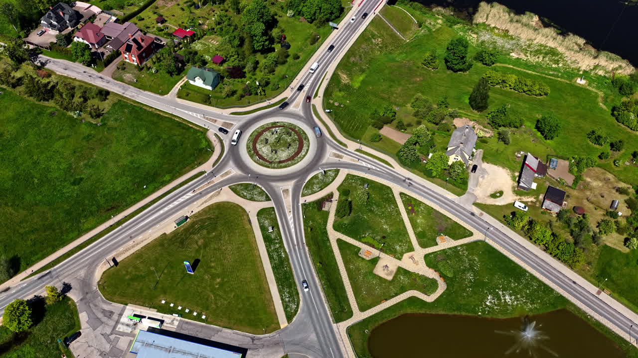 Drone video of multilane roundabout in Bauska, Latvia with bridge over river Mūsa