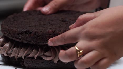 putting second layer of cake close up soft cake