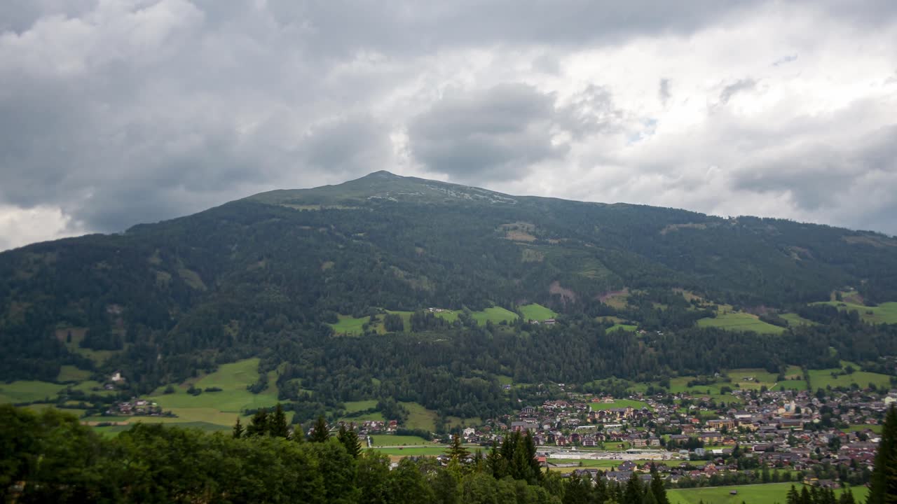 A breathtaking timelapse of the Austrian mountains, with clouds drifting by and sunrays beautifully illuminating the landscape.