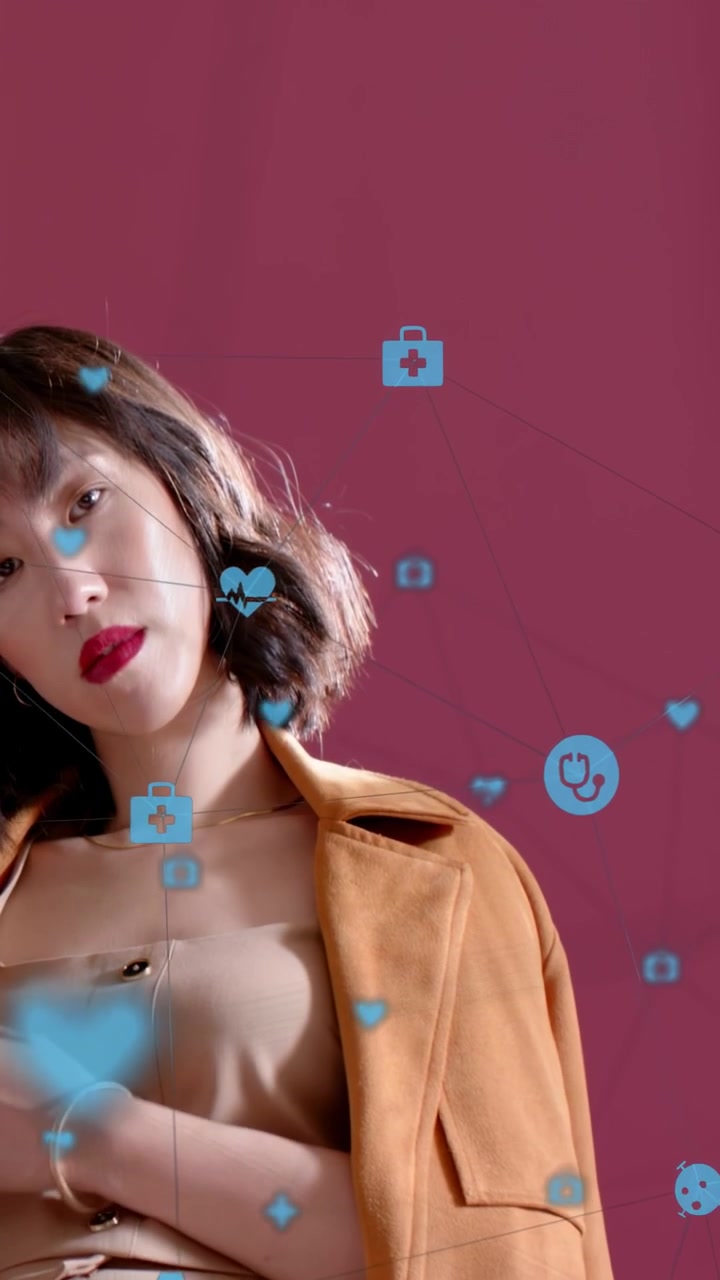 Vertical video: Woman posing while camera panning up, moving hand in for health ad amid blue icons