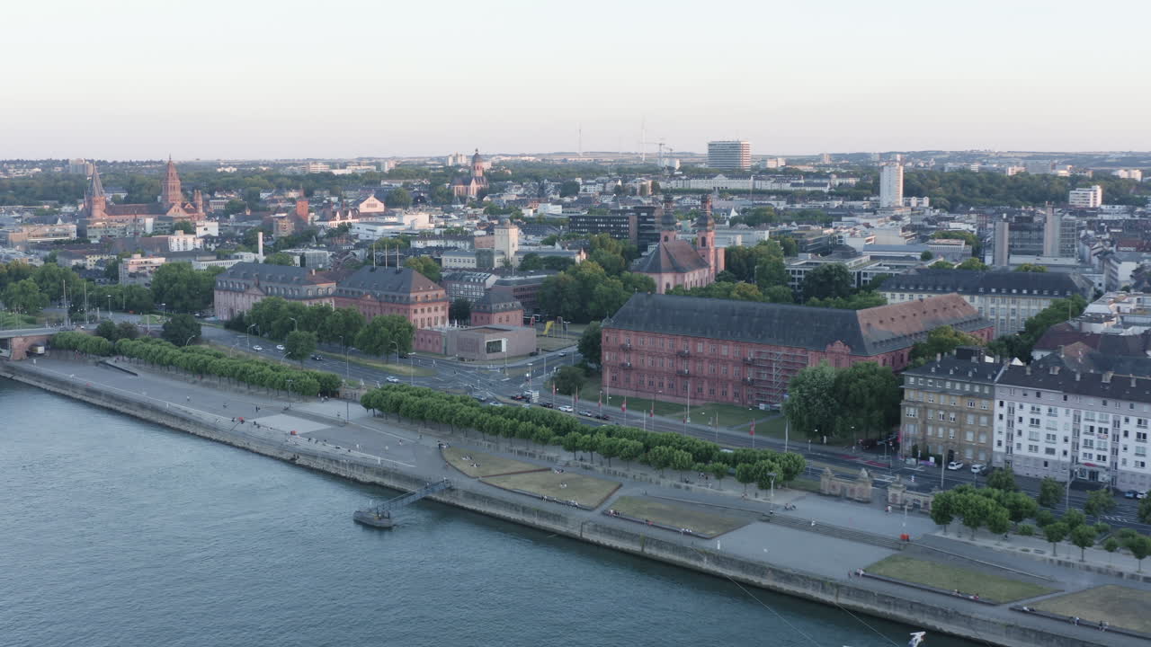 Aerial drone View of Mainz Landtag Rhine River, Castle, dom, Theodor Heuss Bridge and Cityscape at Sunset Germany 4k flight away