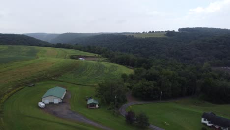 flying over a rural farmland and forest