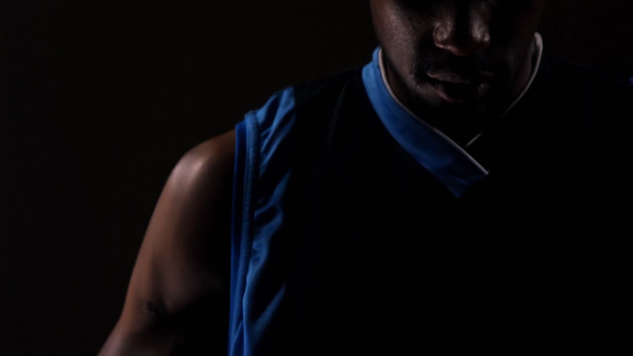 Close-up of sportsman holding basketball