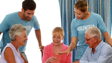 Senior-couple-playing-puzzle