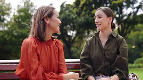 women, friends and laughing at park on bench