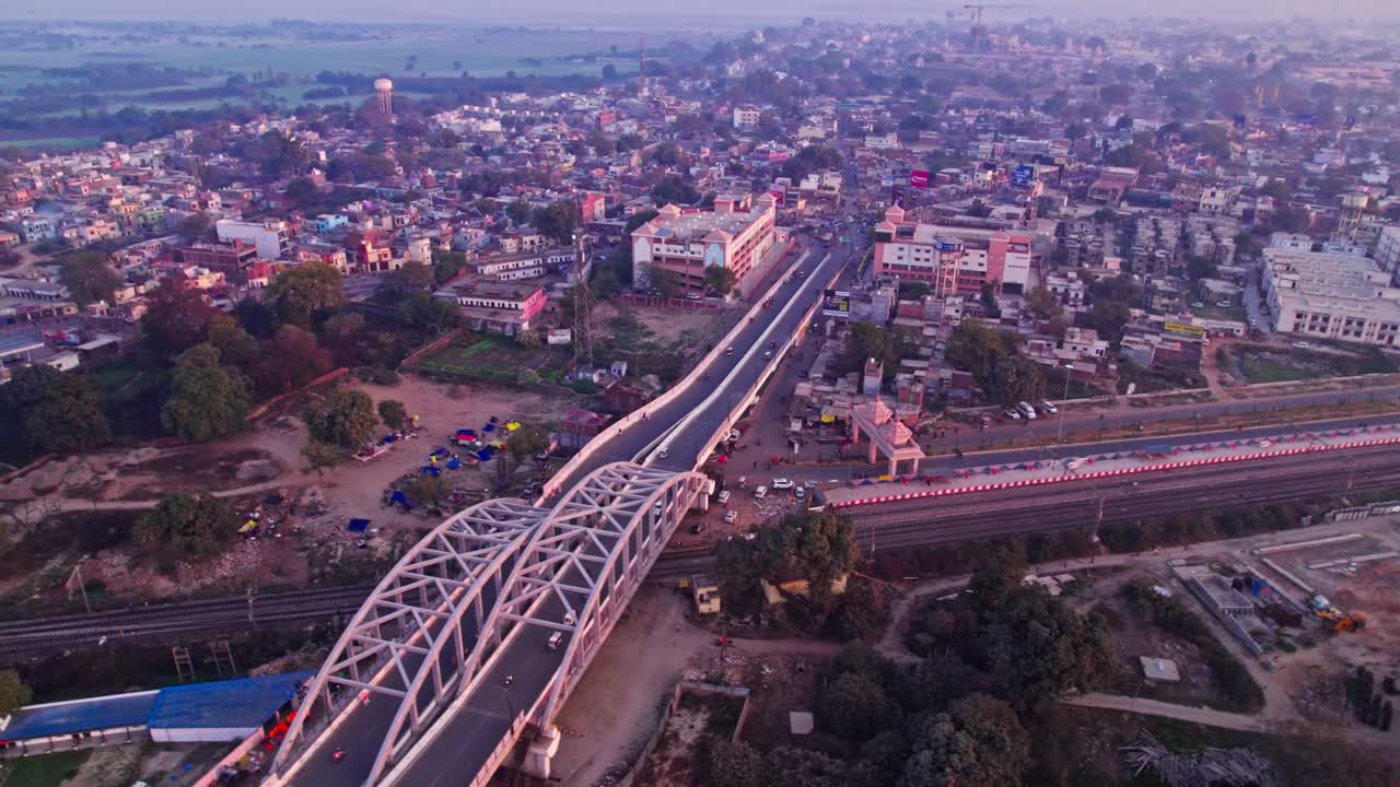 New Ram Mandir under construction Temple with Tedhi Bazar Railway Overbridge and buildings at day time, pan shot, tilt down, drone shot, 4k.