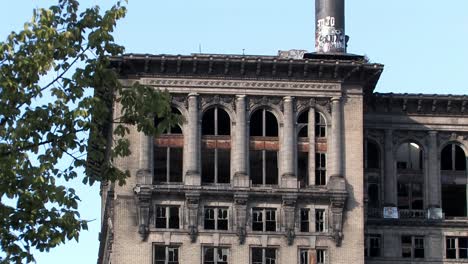 top of left wing of rotten michigan central station in sunshine in 2009, detroit, usa