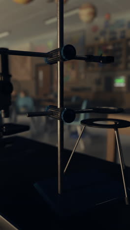 a ring stand with clamps in a science lab