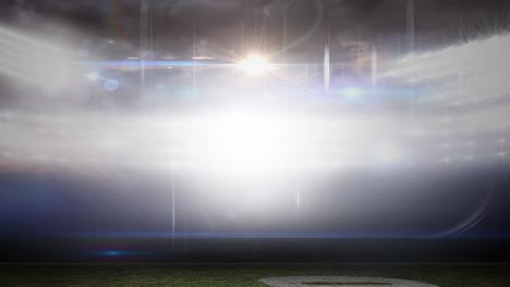 animation of blurred moving lights and bokeh light spots at floodlit sports stadium