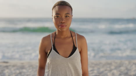 portrait of independent african american woman on summer beach seaside looking camera serious pensive