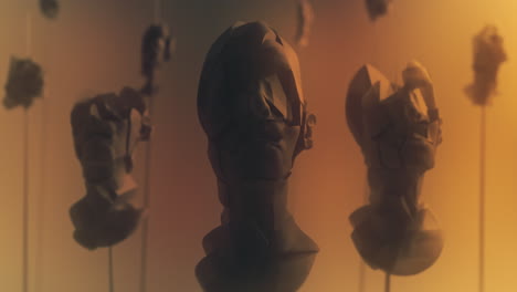 crushed android heads on spikes on the yellow background