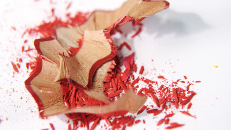 red color pencils shavings on a white background