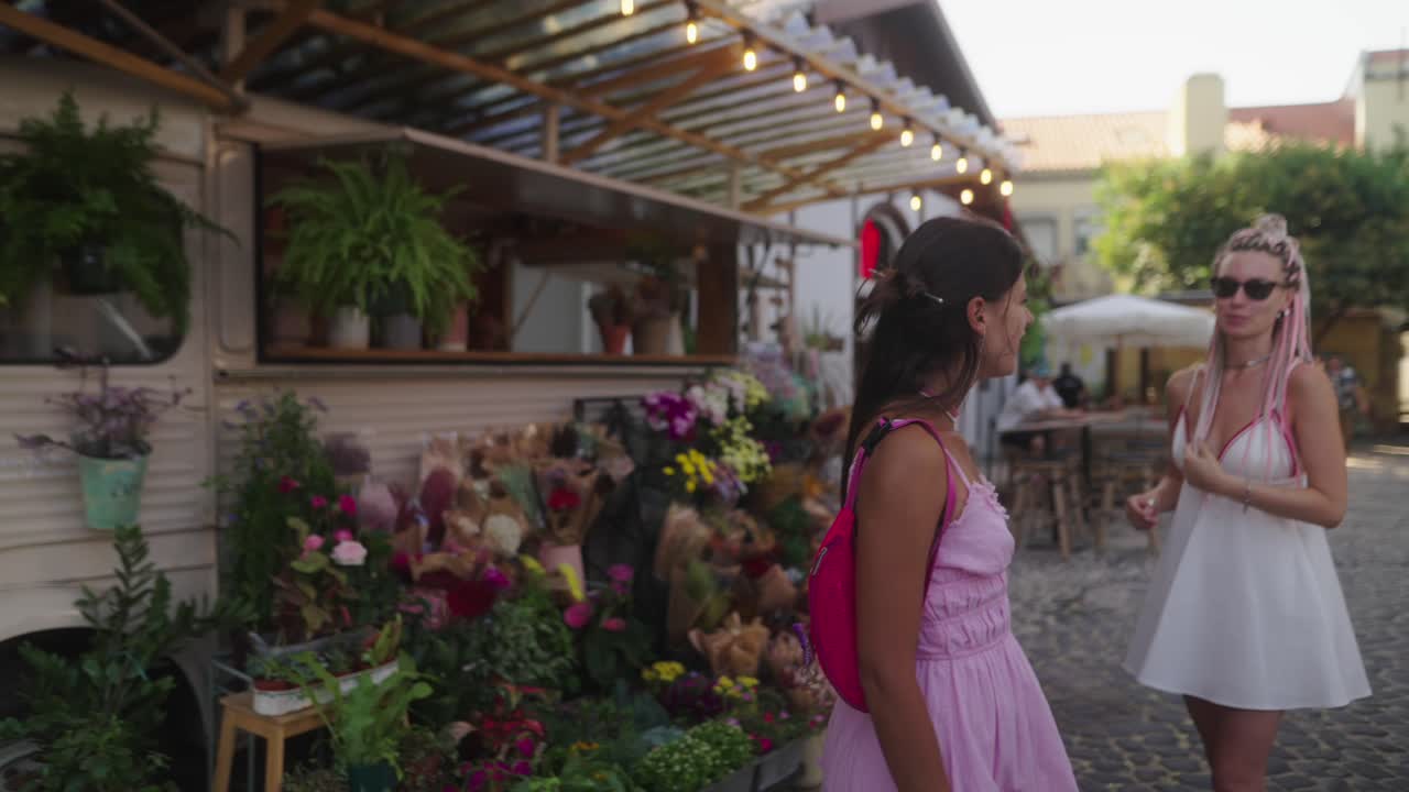 A woman walking on a cobblestone street