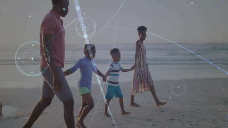 family walking hand in hand along shoreline, showcasing digital network overlay for tech design