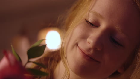 woman smelling roses
