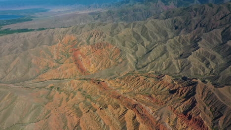 High-aerial-drone-view-of-the-scenic-landscape-around-the-lake,-Issyk-Kul,-Kyrgyzstan