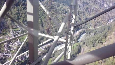 Cableway-Top-Fly-View-of-Swiss-Alps,-Mountain-River-Forest-Valley,-Switzerland-Aerial-in-Braggio-Village