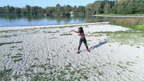 drone shot of young attractive black female doing sports outdoors