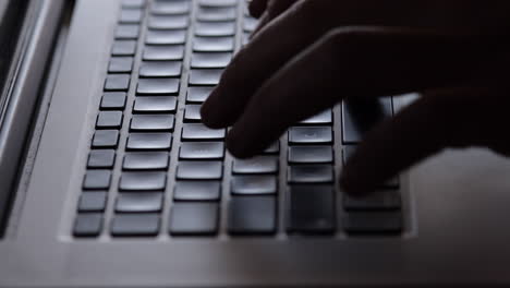 busy person typing on laptop