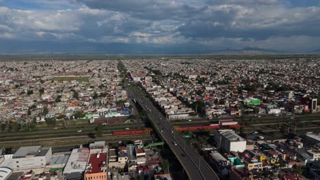 drone footage of everyday hustle in ecatepec on a sunny afternoon with gray clouds