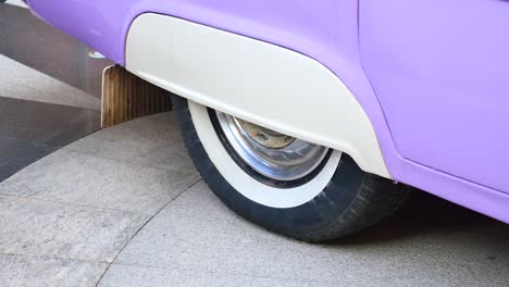 closeup of a purple classic car wheel