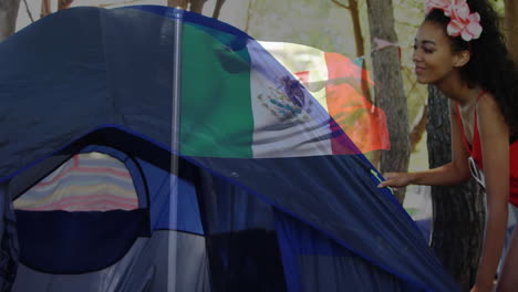 waving mexican flag over blue camping tent in forest with animation