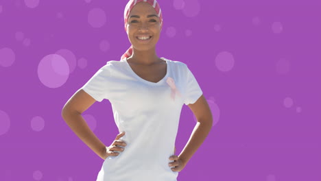 animación de una mujer biracial con una cinta rosa sobre un fondo púrpura