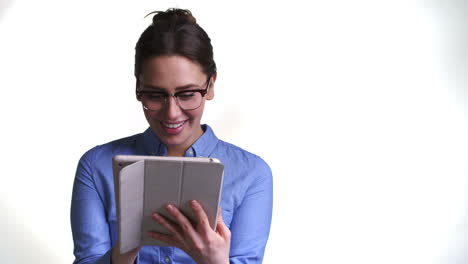 Shot-Of-Woman-Using-Digital-Tablet-Against-White-Background