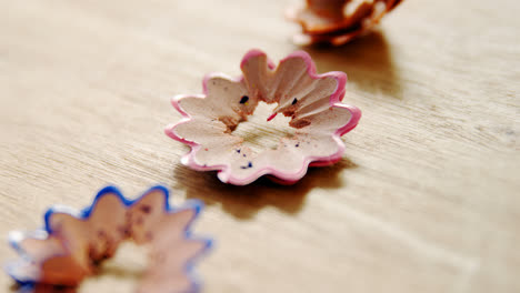 Red,-blue-and-green-colored-pencil-shavings-on-white-background