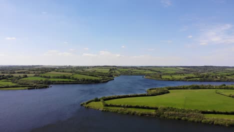 roadford lake with surrounded by green fields