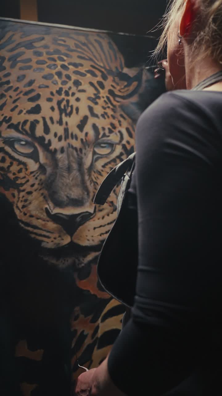 Woman Painting a Leopard