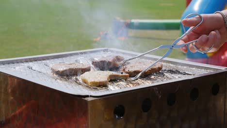 four different kinds of meat being grilled on the barbecue