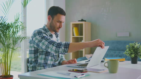 man opening his laptop