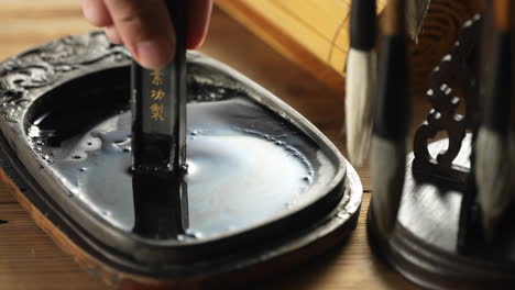 the grinding inkstone ink process traditional chinese being prepared by an artist before paint chinese calligraphy brush ready to use