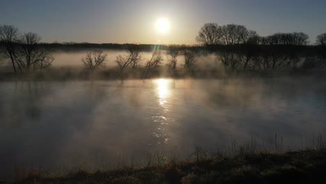 misty sunrise over a river