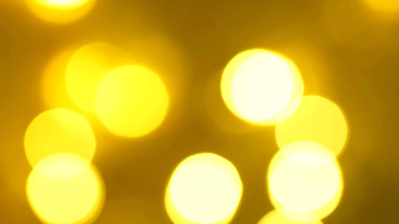 Yellow LEDs quickly flash in a blurry focus.