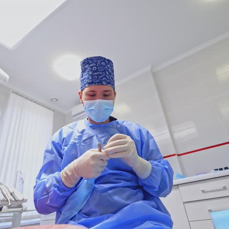 modern dental office. dentist is preparing tools for treating teeth in clinic. doctor is using medical technology. teamwork of doctors. health care concept.