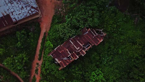 top down aerial of a collapsed shed in a small village in nigeria, africa