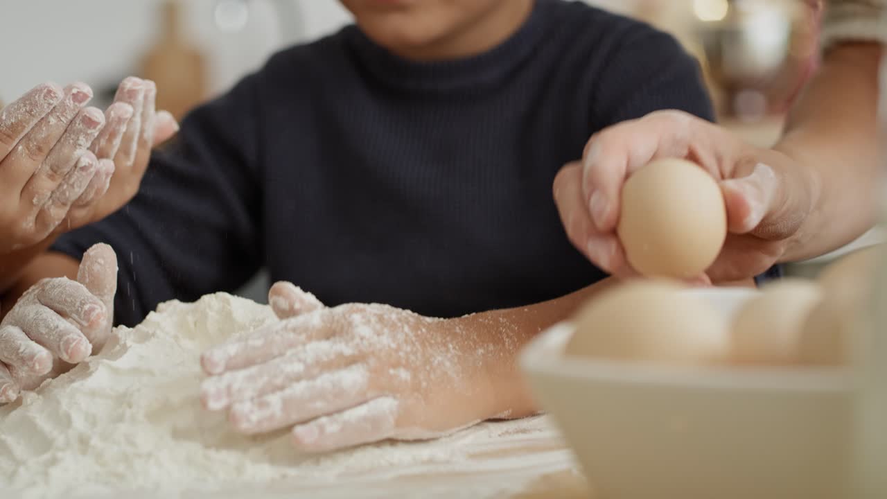 Close up video of children using flour on bakeboard