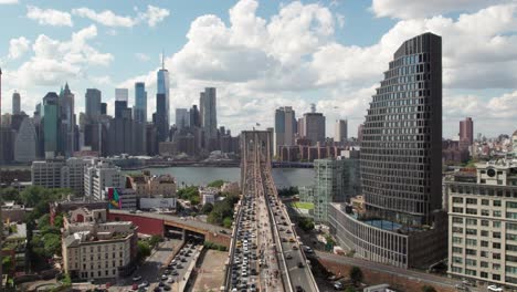 Aerial-shot-of-Downtown-Brooklyn,-NY,-with-Brooklyn-Bridge-in-foreground,-4K