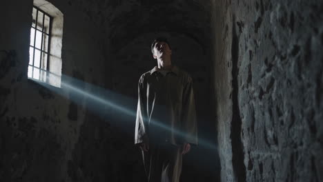 prisoner in a dark cell