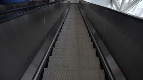 A-first-person-view,-going-down-escalators,-recorded-at-60-frames