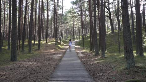 girl likes running in the forest