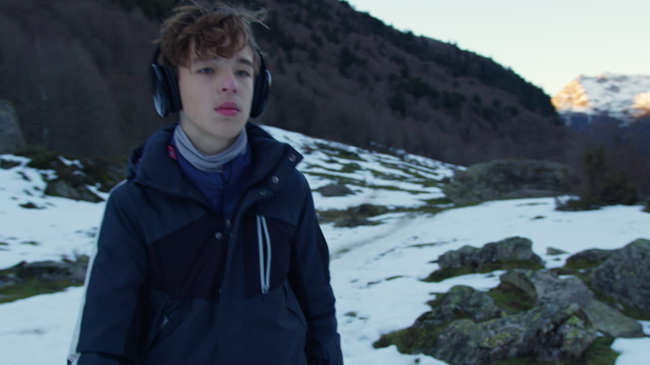 Teenager Hiking in Snowy Mountains
