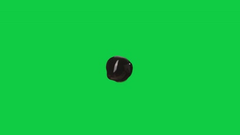 primer plano en una sola perla de tapioca boba marrón, fondo de pantalla verde